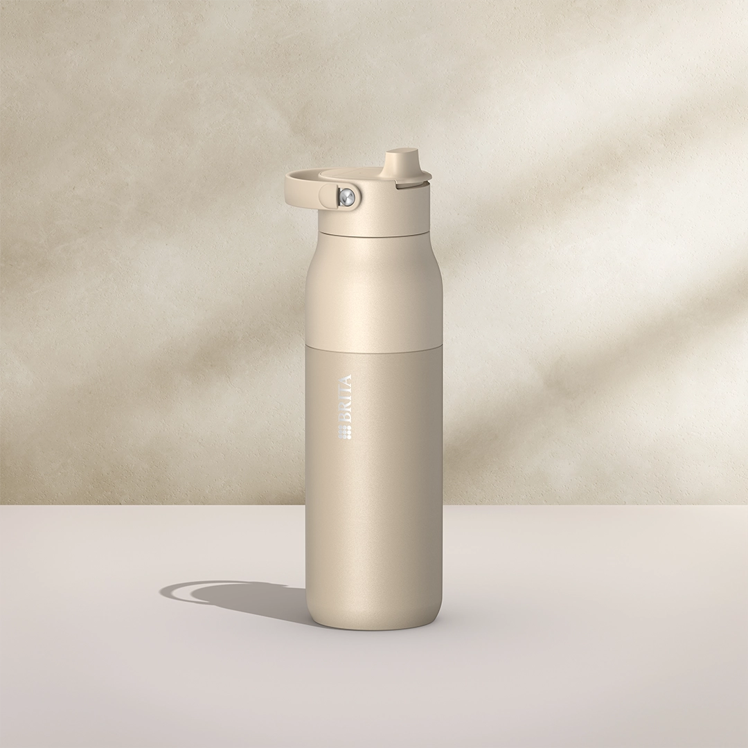 BRITA LARQ Essential Bottle, 1000 ml, in beige on a beige background.