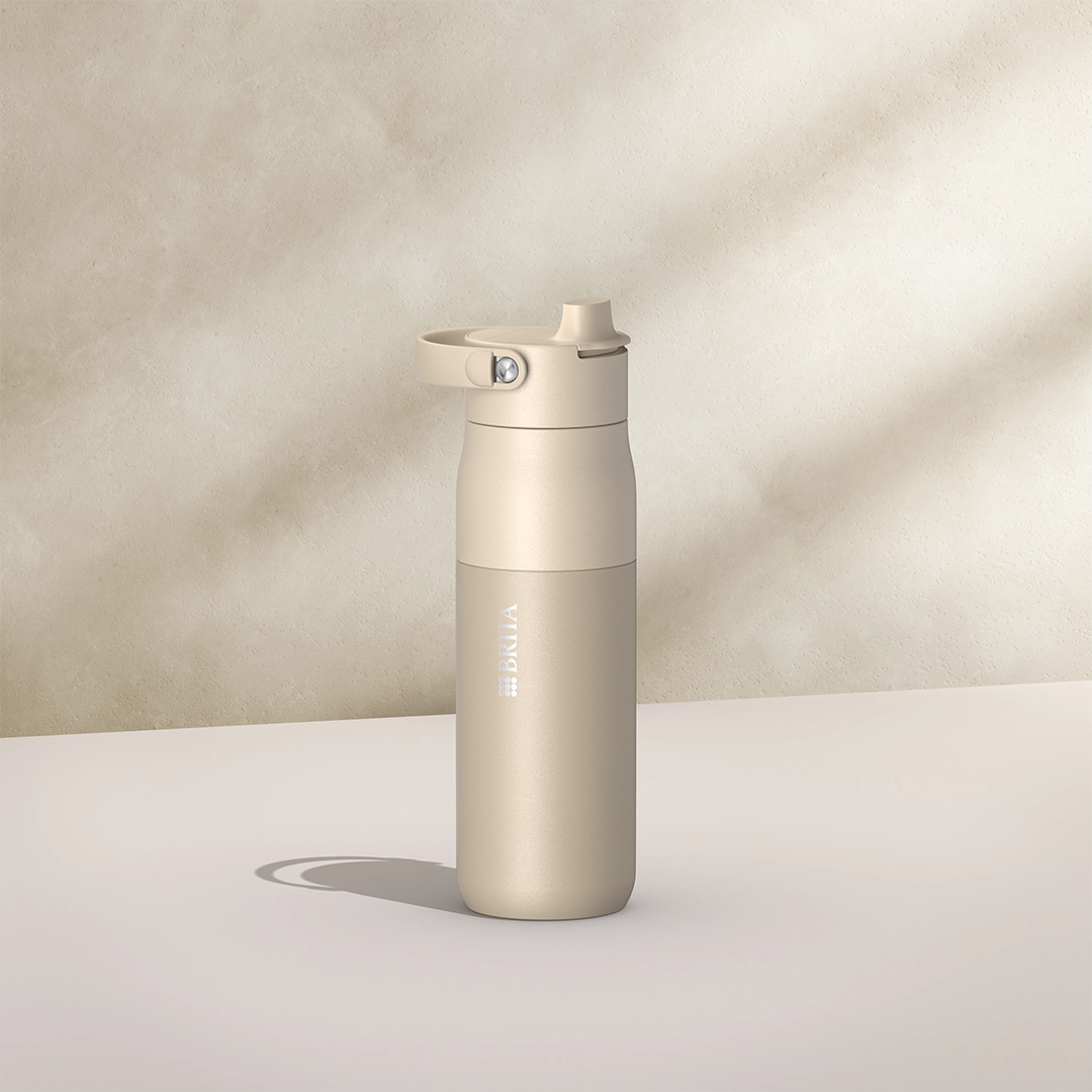 BRITA LARQ Essential Bottle, 680 ml, in beige on a beige background.
