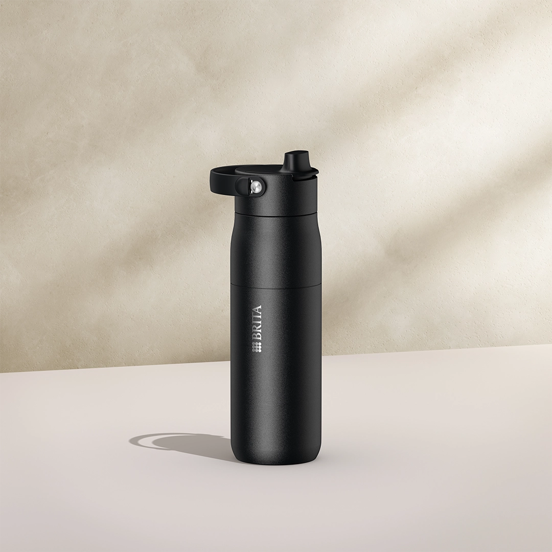 BRITA LARQ Essential Bottle, 680 ml, in black on a beige background.