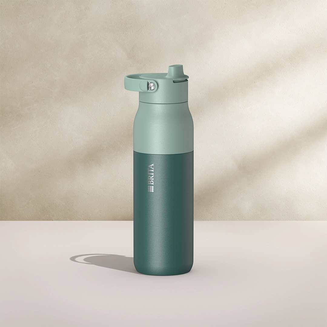 BRITA LARQ Essential Bottle, 1000 ml, in green on a beige background.