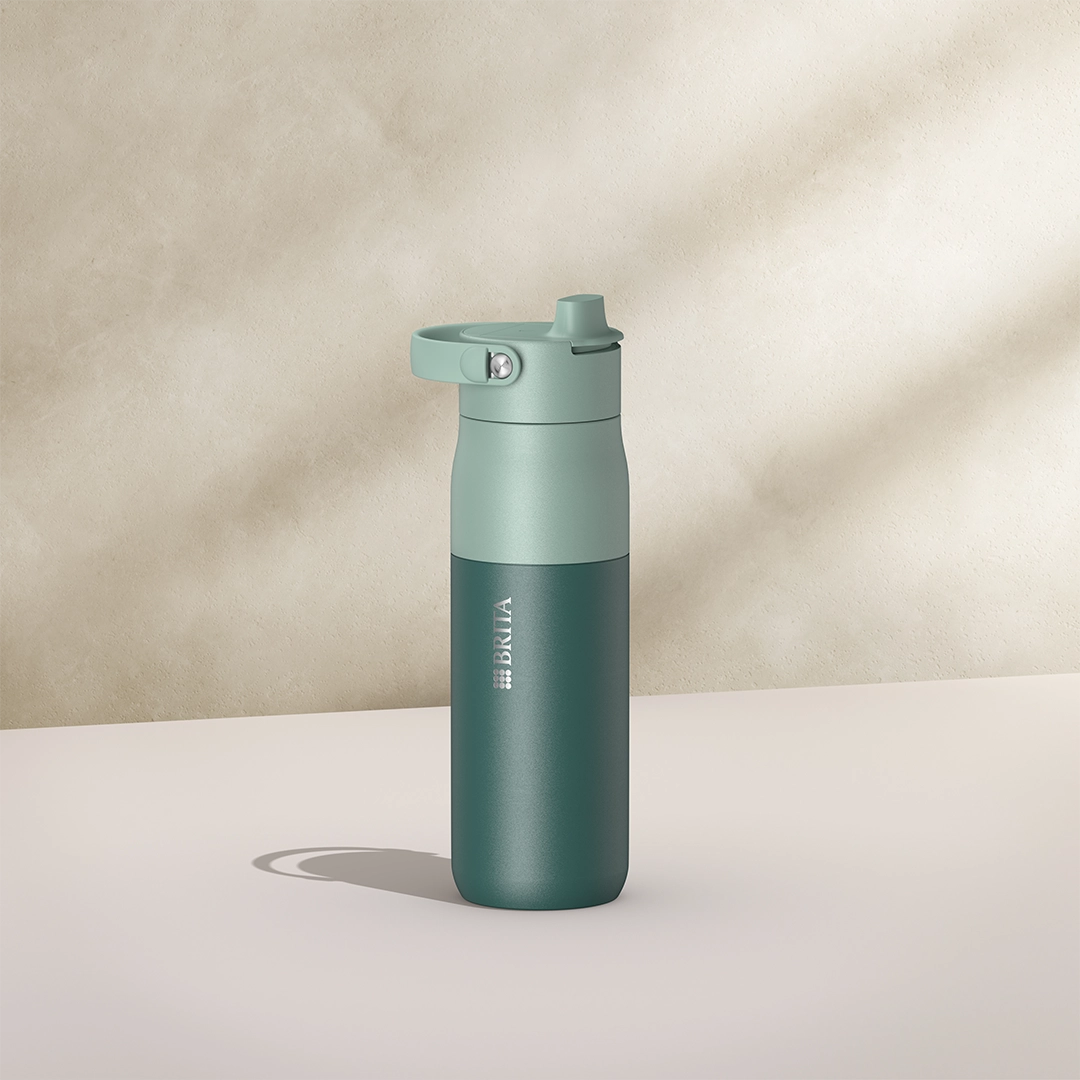 BRITA LARQ Essential Bottle, 680 ml, in green on a beige background.