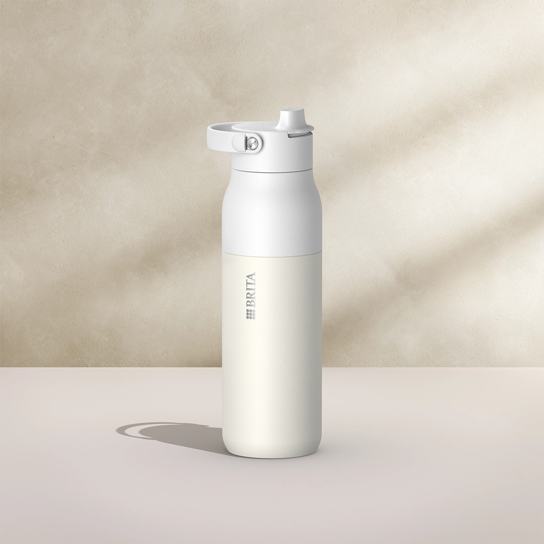 BRITA LARQ Essential Bottle, 1000 ml, in white on a beige background.