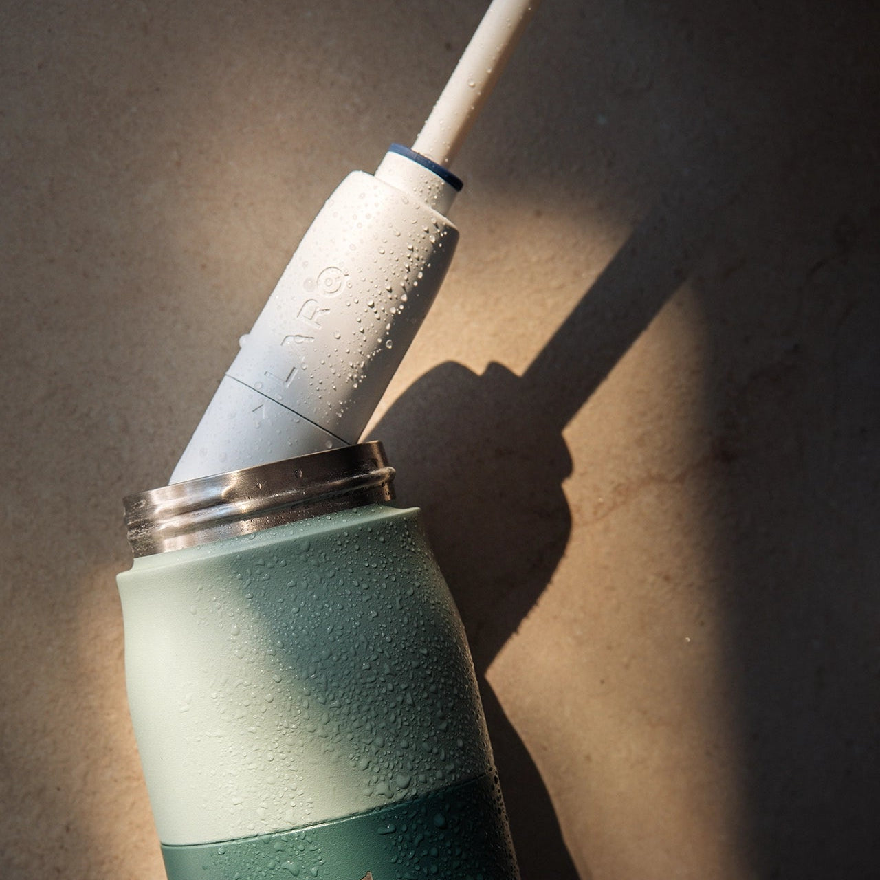 Close-up of a BRITA LARQ Filter Upgrade Kit cartridge being inserted into a BRITA LARQ bottle