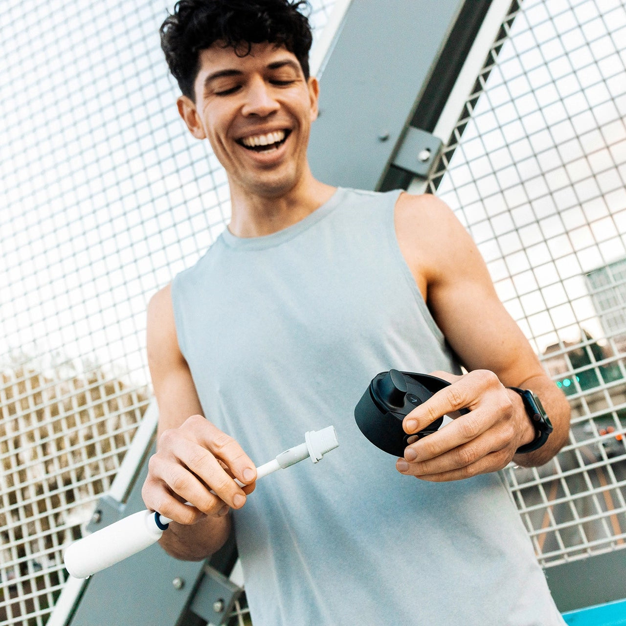 Person inserting a BRITA LARQ Filter Upgrade Kit cartridge into a BRITA LARQ Bottle 