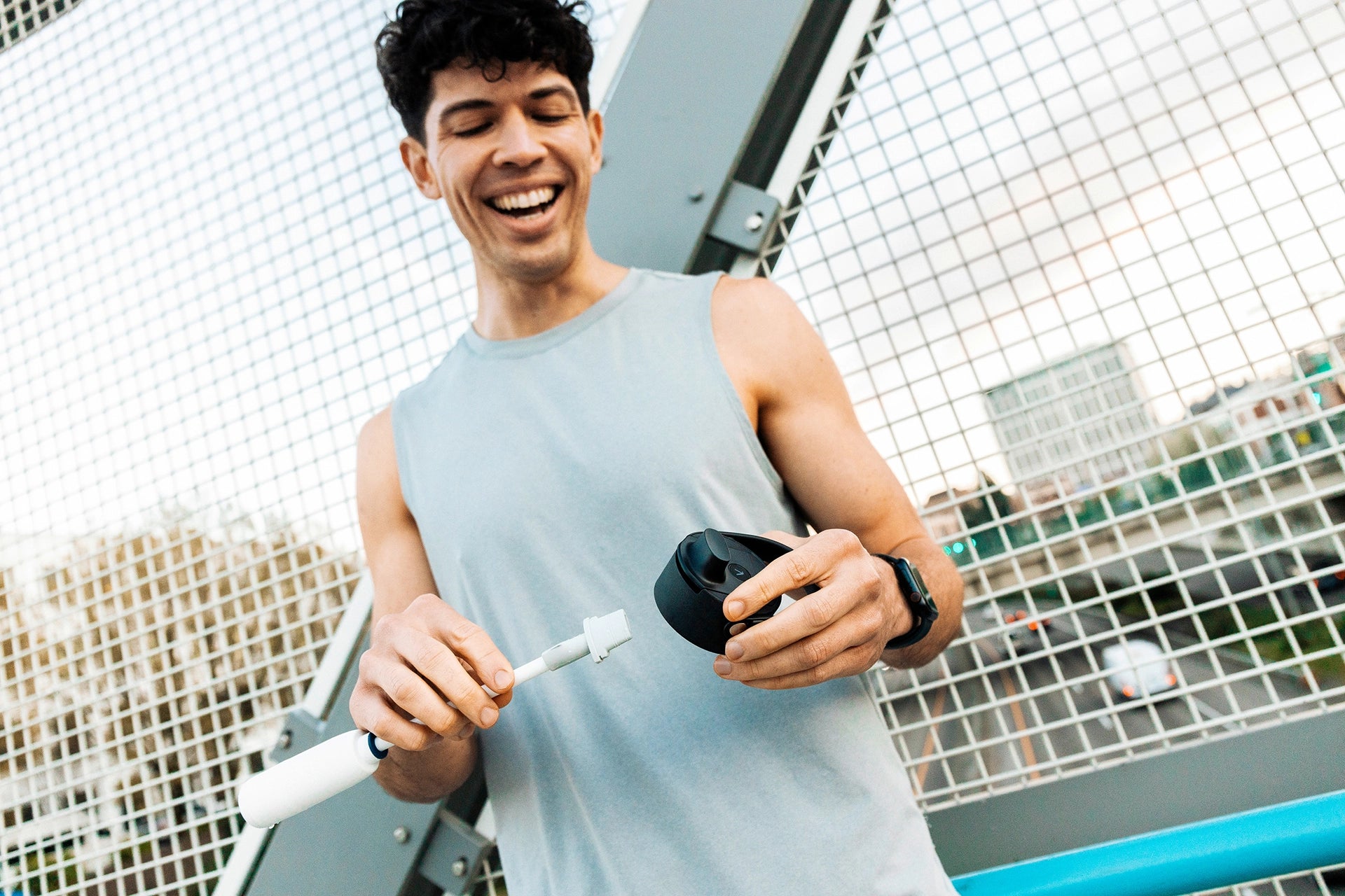 Person inserting a BRITA LARQ filter upgrade kit into a BRITA LARQ iQ bottle cap.