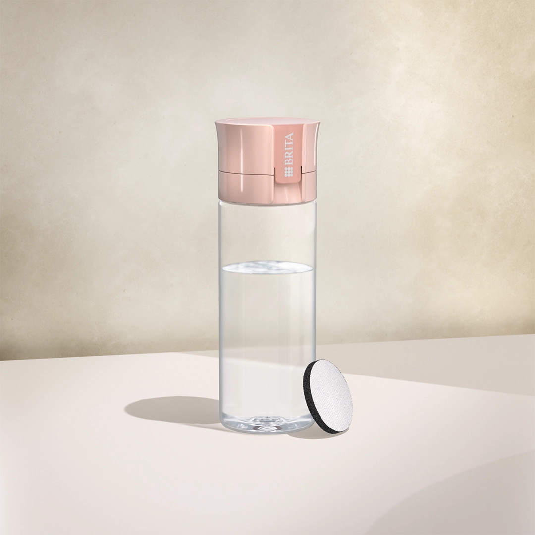 BRITA water filter bottle Vital in apricot on a beige background