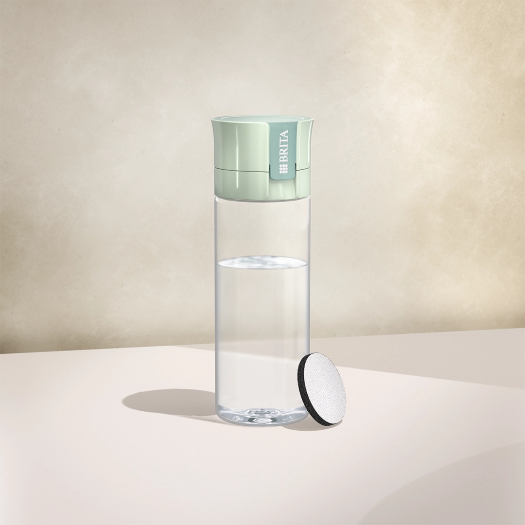 BRITA water filter bottle Vital in light green on a beige background
