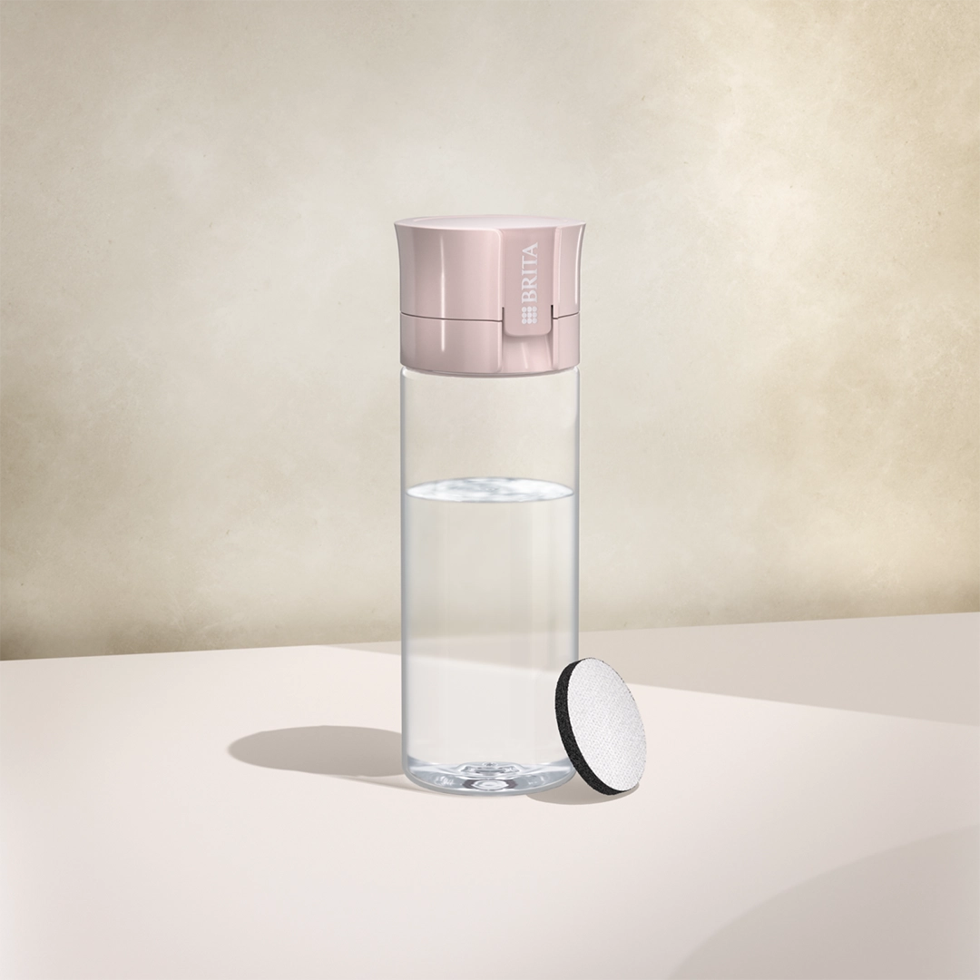 BRITA water filter bottle Vital in mauve on a beige background