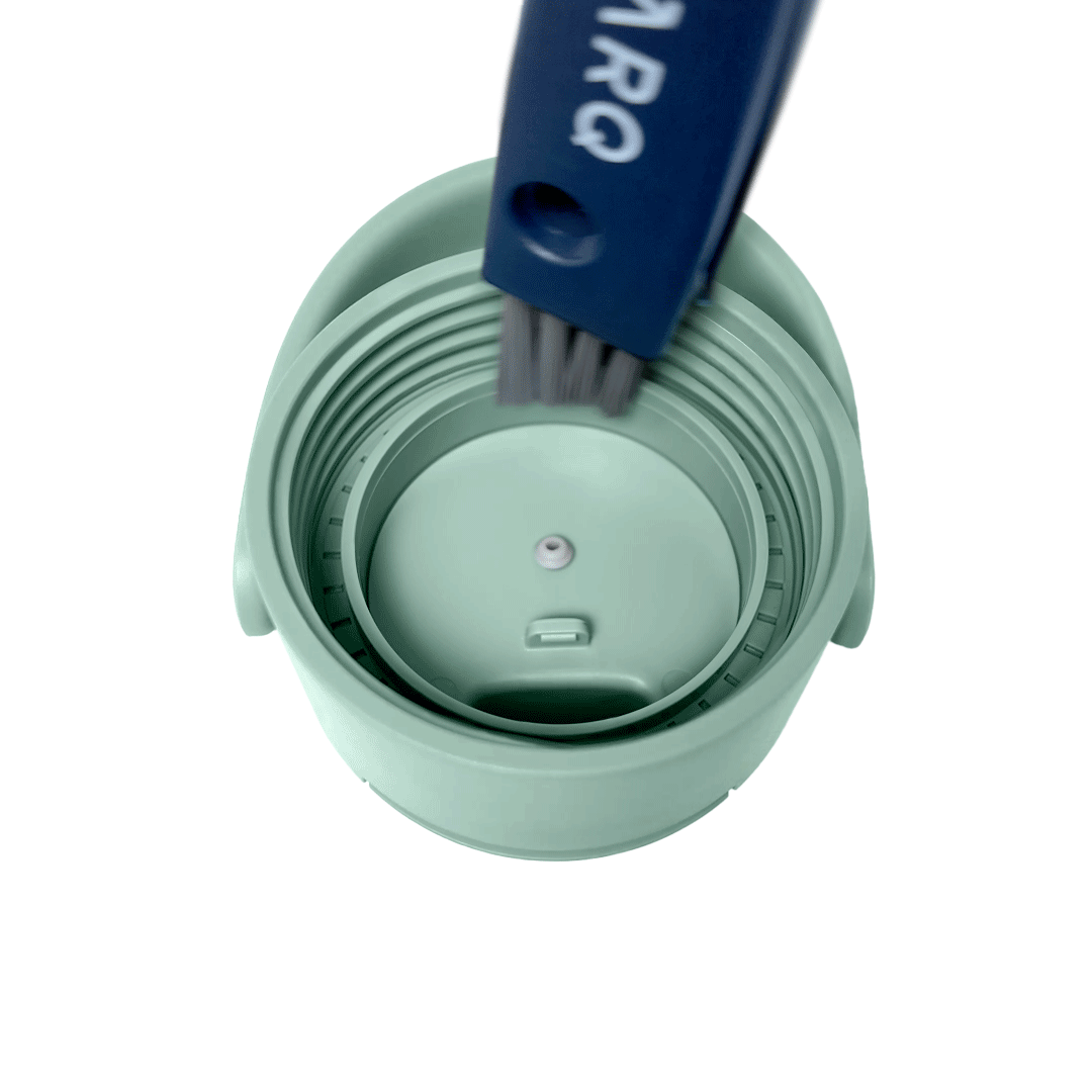 BRITA LARQ Cleaning Brush cleaning the inside of a BRITA LARQ bottle cap.