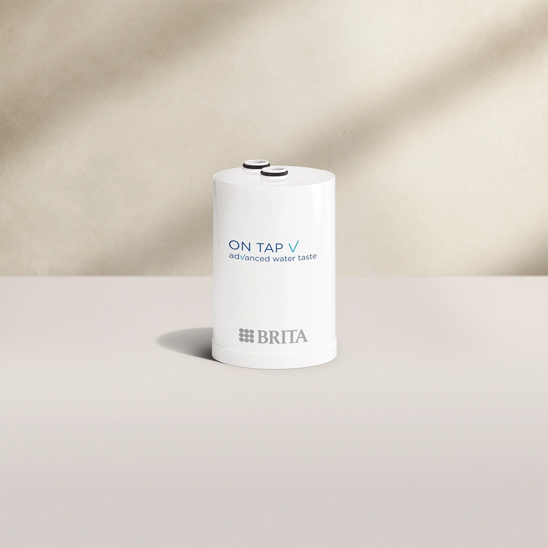 BRITA ON TAP V Water Filter Cartridge on beige background