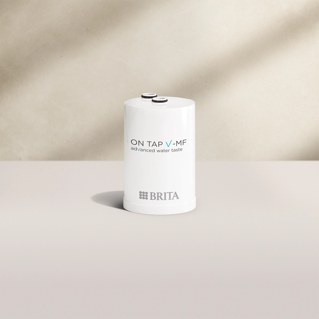 BRITA ON TAP VM-F Water Filter Cartridge on beige background