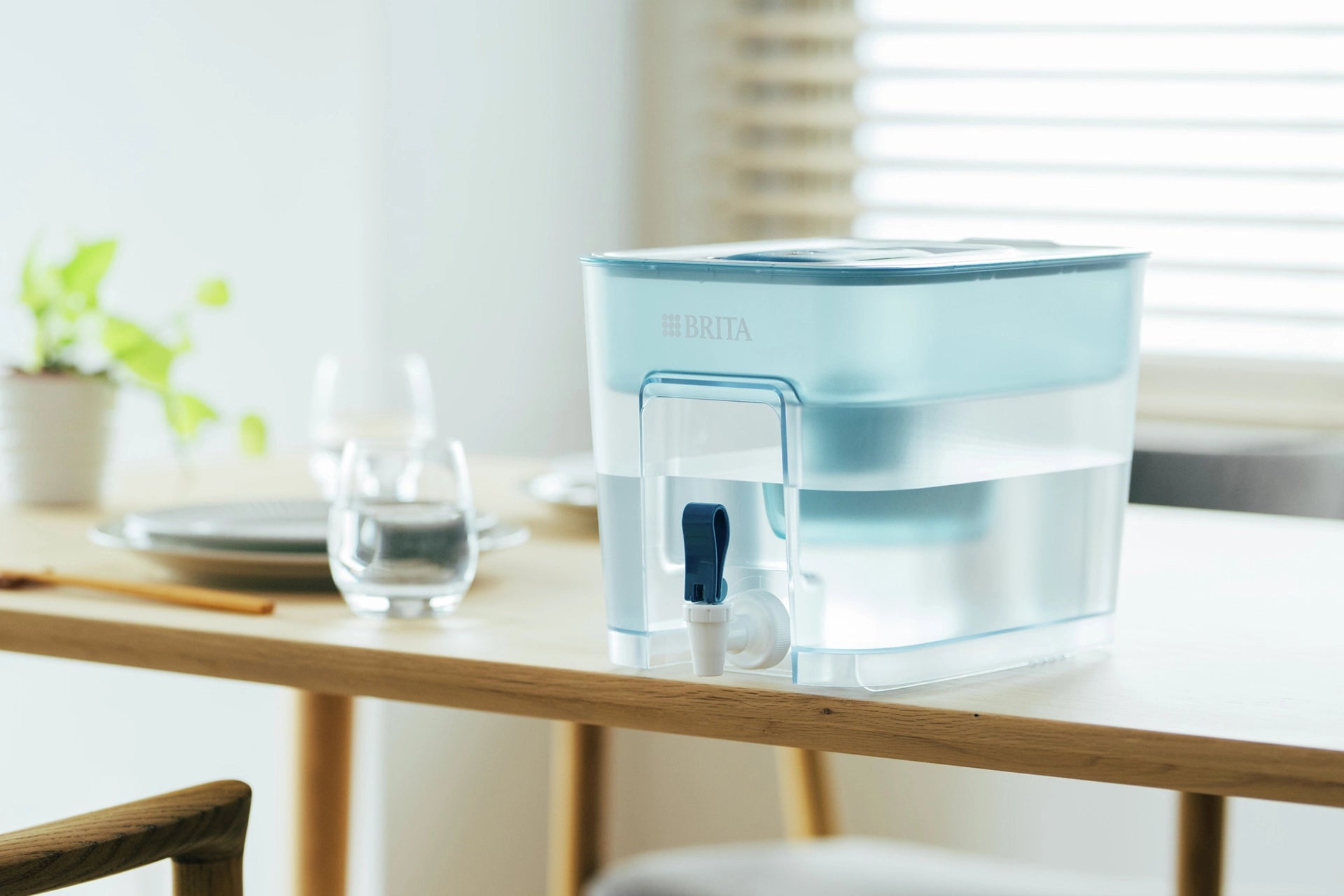 BRITA Flow on a wooden table with a light background.