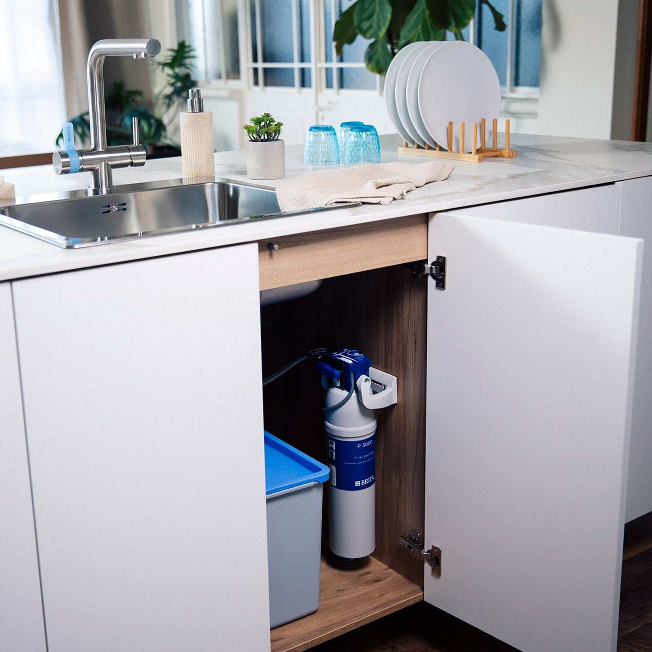 Under-sink BRITA P 3000 filter cartridge connected to a BRITA 3-way kitchen tap